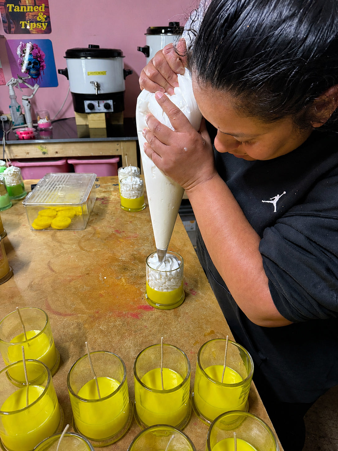 Deirdre making Maple Beech Co dessert candles by hand